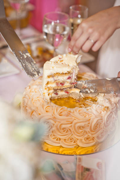 istock Man with a knife cut the cake into pieces 7417. 675055846