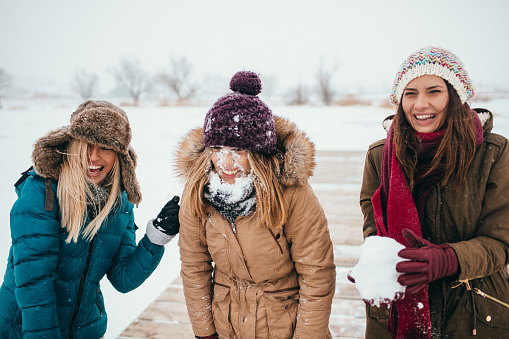 Girlfriends In A Snowball Fight Stock Photo - Download Image Now - 20 ...