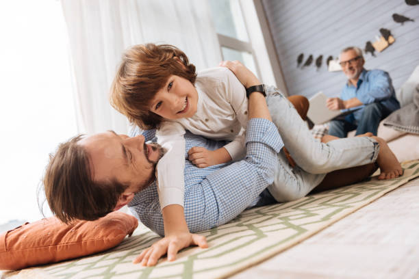 istock Cute happy boy spending time with his father 675060636