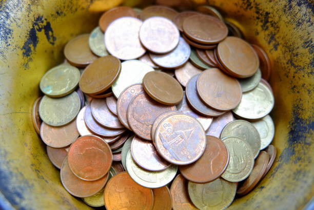 istock Old Thai Coins in Bowl. 675060674