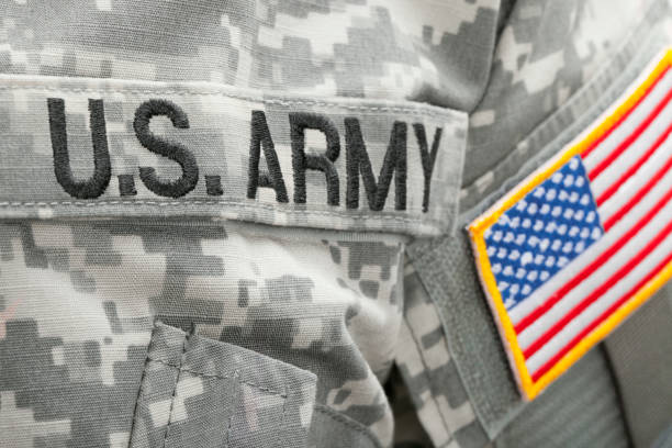 istock US flag and U.S. ARMY patch on military uniform - close up shot 675061912