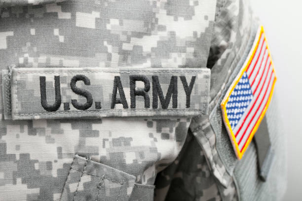 istock US flag and U.S. ARMY patch on military uniform - close up studio shot 675062764