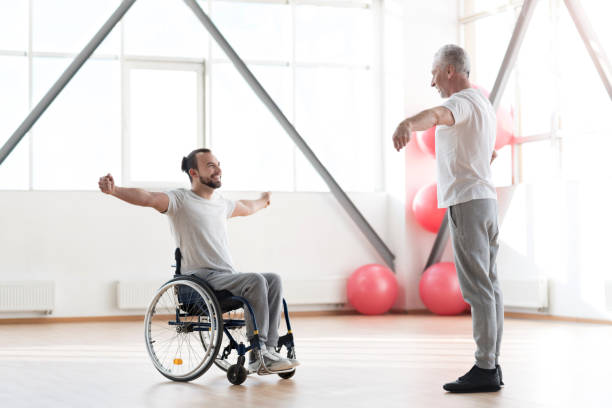 istock Delighted young disabled patient training with the orthopedist 675062992