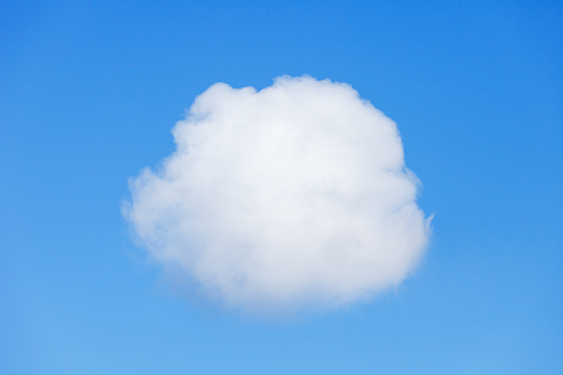 single, small, white cloud on blue sky background