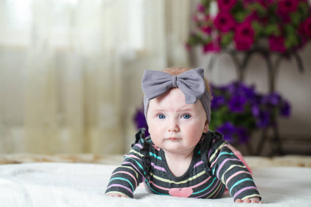 istock The baby is lying on the bed. 675064904