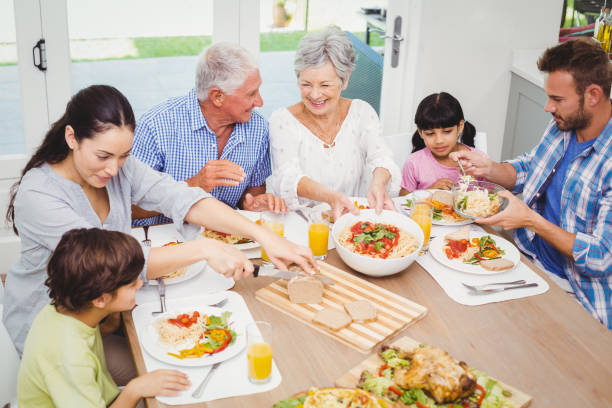 istock Smiling multi generation family having food 675064918