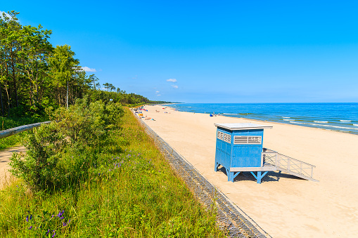 Blue lifeguard booth on sandy beach in Jastrzebia Gora, Baltic Sea, Poland