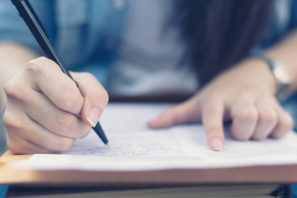 istock Young asian woman filling job application documents 675067494