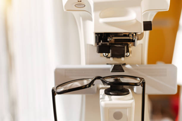 istock Professional optician examining new glasses 675068810