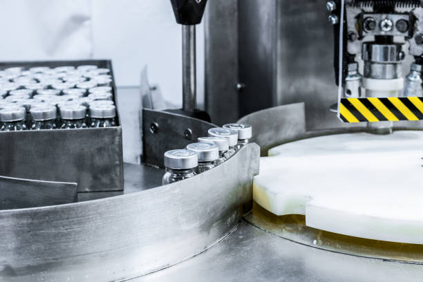 istock Glass bottles for preparations in the machine for capping 675069202