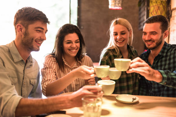 istock friends using take a cappuccino at the cafe 675072868
