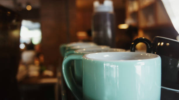 istock close up coffee cup  in coffee shop blurr background. 675073150