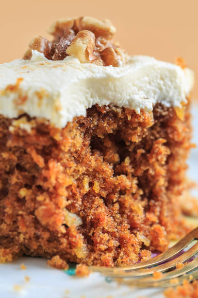 Carrot Cake Piece Close-Up Of Fresh Carrot Cake Piece carrot cake day stock pictures, royalty-free photos & images