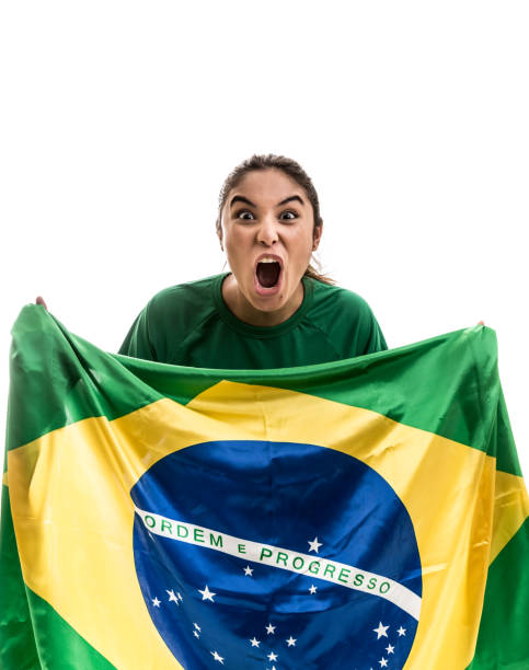 istock Brazilian fan celebrating on white background 675075304