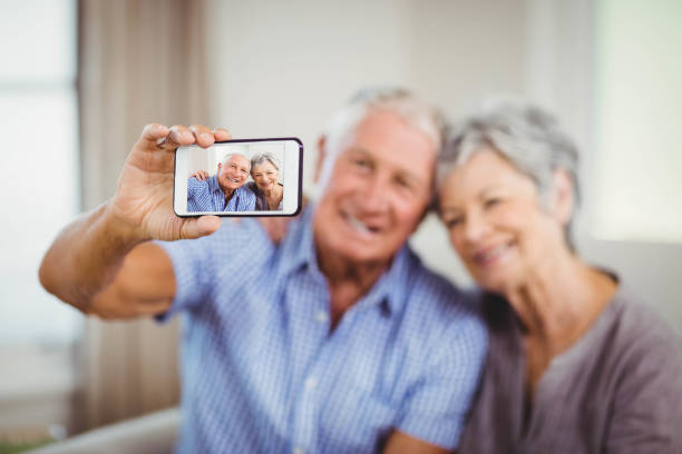 istock Senior couple taking a selfie 675075774