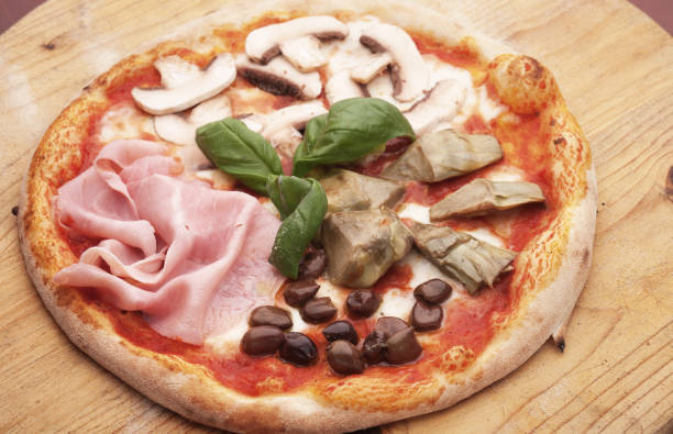 istock Pizza Quattro Stagioni, with ham and artichokes 675077466