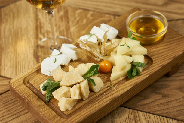 istock Cheese plate with honey and wine 675077522