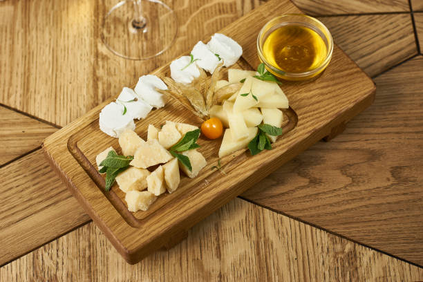 istock Cheese plate with honey and wine 675077620