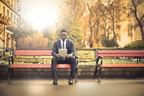 istock Businessman in public park 675078224