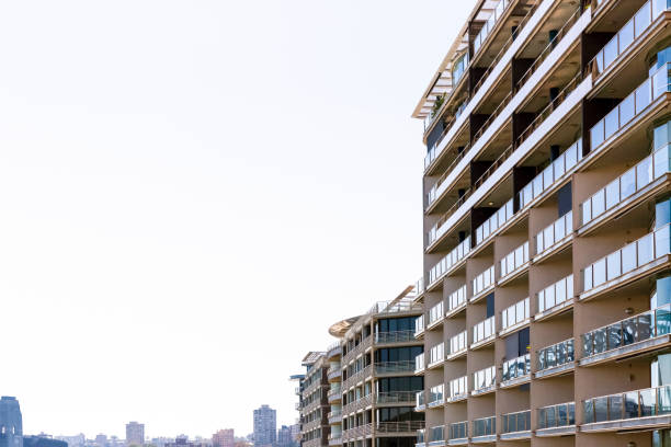 istock Modern apartment building against white background with copy space 675079270