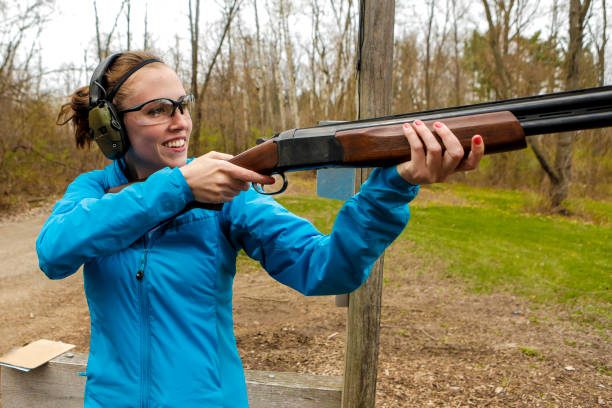 Young woman in shooting gear stock photo