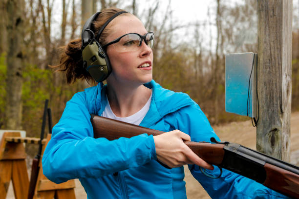 istock Young woman in shooting gear 675083166