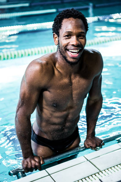 istock Smiling fit man in the swimming pool 675087920
