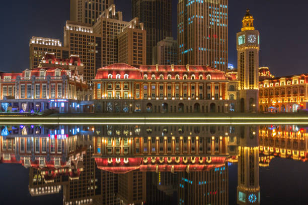 istock River And Illuminated Modern Buildings Against Sky at night 675094904