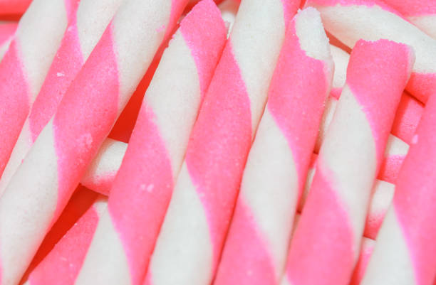 wafer rolls wafer rolls filled with strawberry stick pattern ice cream with wafer rolls stock pictures, royalty-free photos & images