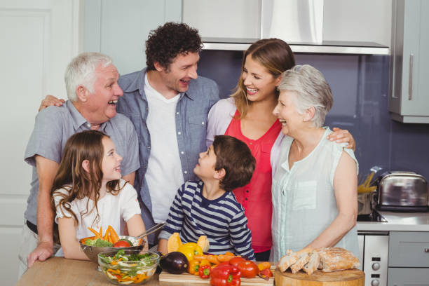 istock Happy family standing in kitchen 675166130