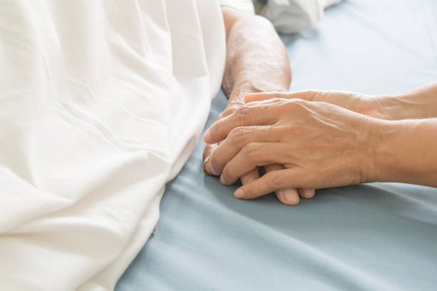 istock hospital patient hands to care 675171748