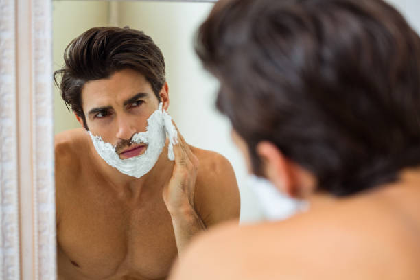 istock Man applying shaving foam 675173446
