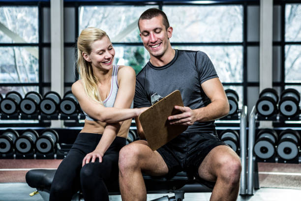 istock Fit woman discussing performance with trainer 675176878