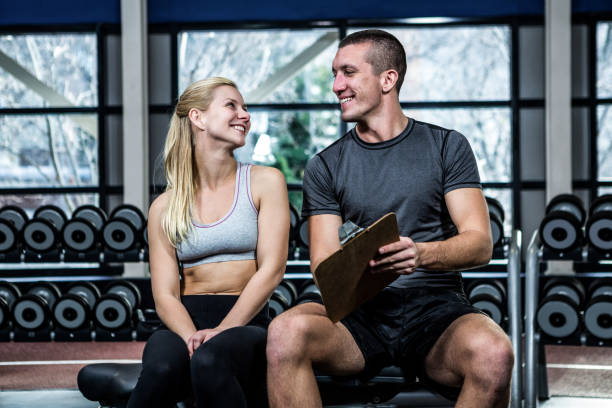 istock Fit woman discussing performance with trainer 675176902