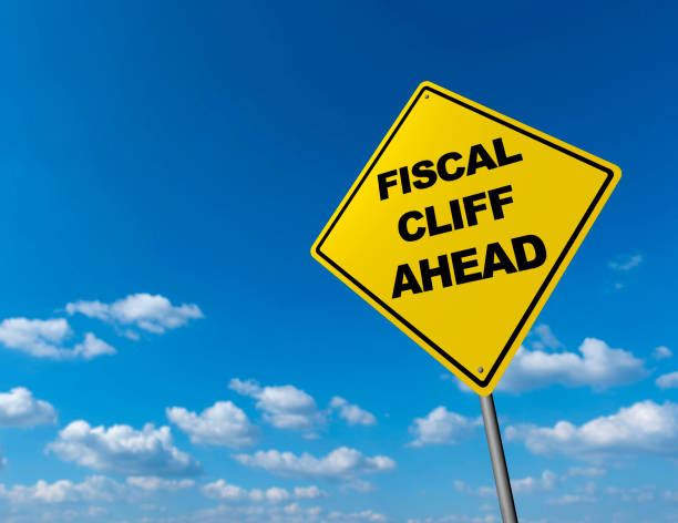 istock Fiscal Cliff Ahead  - Road Warning Sign 675182736