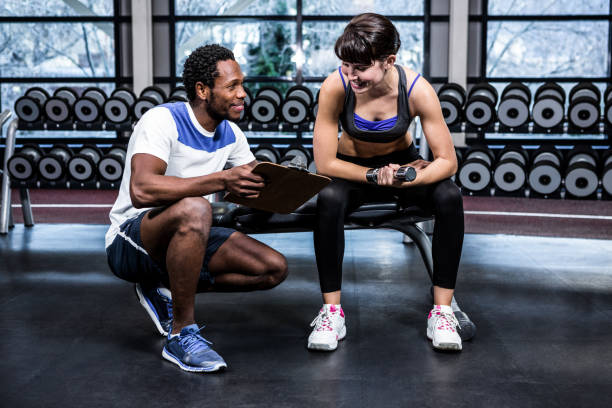 istock Fit woman discussing performance with trainer 675183000
