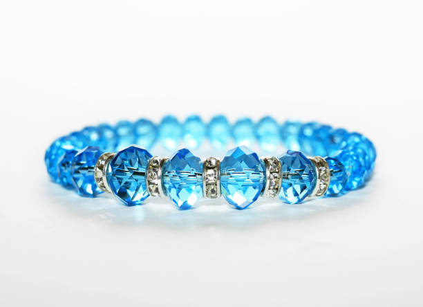 Blue bracelet isolated on white with special lightning