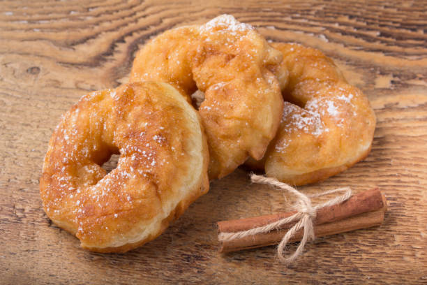 istock sugary donut on a wooden background 675195492