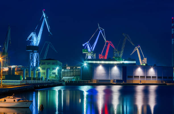 istock Giant cranes at night in Pula 675196568