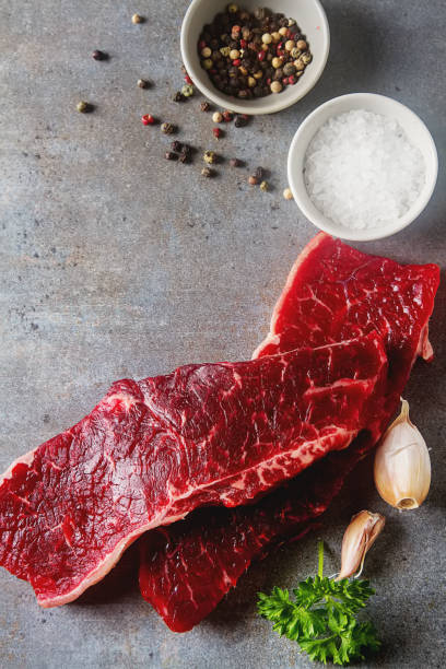 istock A quality piece of meat, beef. Dark background. 675199366