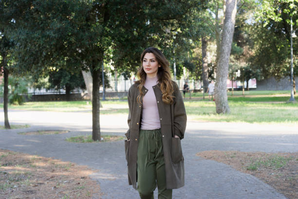 istock Thoughtful girl walking in a park 675200694
