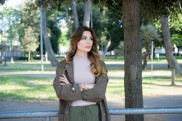 istock Girl waiting in a park 675200732