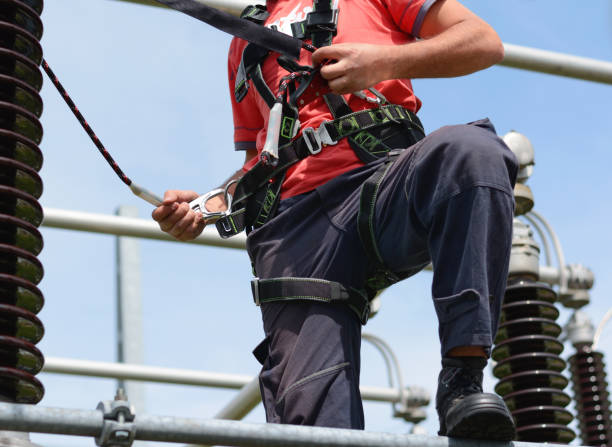 istock Electrician  safety harness working in Construction Harness 675205696