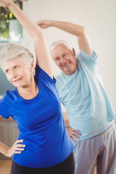 istock Senior couple performing stretching exercise 675206106