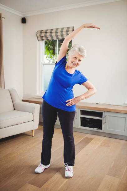 istock Senior woman performing stretching exercise 675206606