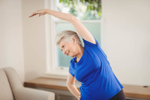 istock Senior woman performing stretching exercise 675206716