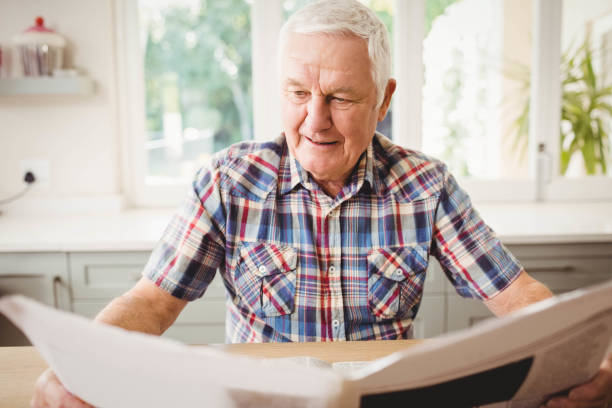 istock Senior man reading a newspaper 675209194