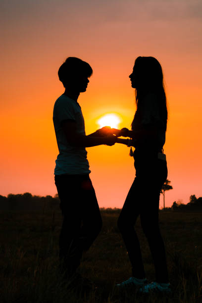 istock Silhouette couple holding hand. 675213768