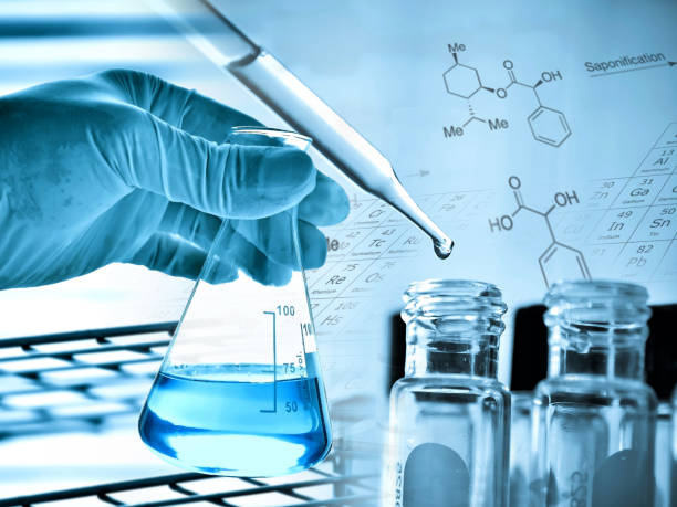 istock Flask in scientist hand with laboratory glassware background 675219698