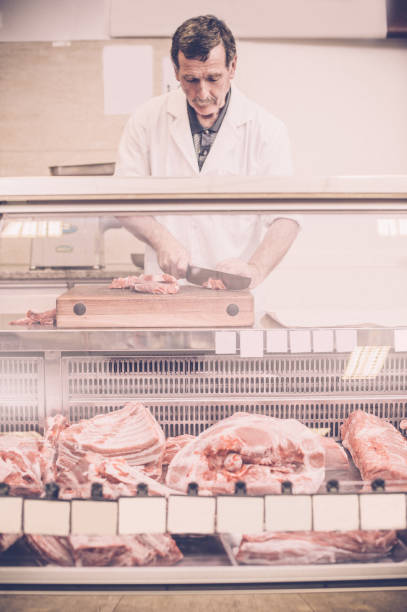 istock Butcher Cutting the Steaks 675220070